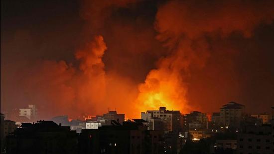 Smoke billows from a fire following Israeli airstrikes on multiple targets in Gaza City, controlled by the Palestinian Hamas movement, early on May 16. (File photo)