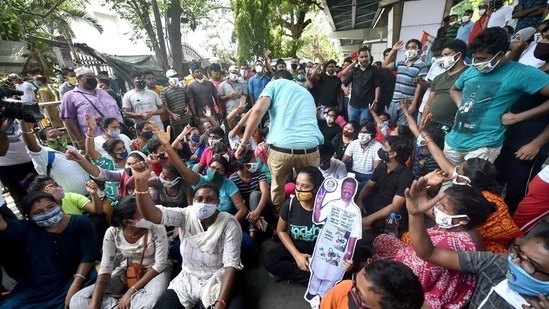 TMC activists shout slogans as they protest outside the CBI office in Nizam Palace, Kolkata, over the arrest of party leaders in connection with the Narada scam case on Monday, May 17. (PTI)