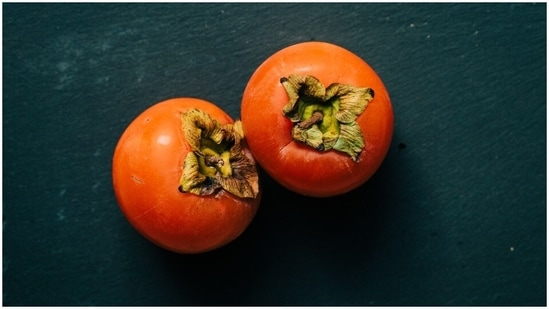 Persimmon (Japani Phal): This is a sweet fruit found in Himachal Pradesh, Jammu and Kashmir, Uttarakhand and Nilgiri Hills. This orange-coloured fruit is loaded with nutrients. It contains beneficial plant compounds that have antioxidant qualities. Studies say that Persimmon can lower the risk of heart disease, lung cancer, colorectal cancer and metabolic disease.(Unsplash)