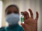 A health worker holds up a vial of Covishield at PSRI Hospital in New Delhi.(HT Photo) A health worker holds up a vial of Covishield at PSRI Hospital in New Delhi.(HT Photo)
