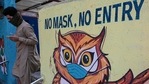 A pedestrian walks past a Covid-19 coronavirus awareness mural reading 'no mask, no entry' in Mumbai on May 12, 2021.(AFP Photo) A pedestrian walks past a Covid-19 coronavirus awareness mural reading 'no mask, no entry' in Mumbai on May 12, 2021.(AFP Photo)