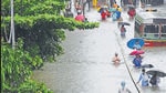 Commuters wade through a waterlogged street at Parel following heavy rainfall, in Mumbai in August, 2020. (HT archive) Commuters wade through a waterlogged street at Parel following heavy rainfall, in Mumbai in August, 2020. (HT archive)