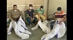 The volunteers say that cremating bodies while wearing PPE kits in the searing heat is a major challenge. Two of them had even fainted last week. (Gurpreet Singh/HT) The volunteers say that cremating bodies while wearing PPE kits in the searing heat is a major challenge. Two of them had even fainted last week. (Gurpreet Singh/HT)