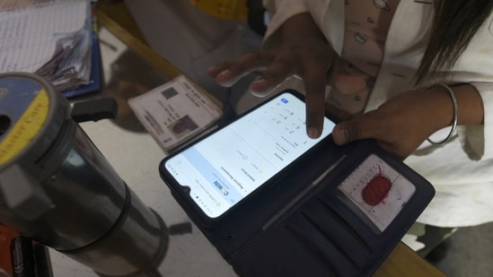 A health worker registering a person on the CoWin app for Covid-19 vaccination. (Sunil Ghosh/HT file photo)