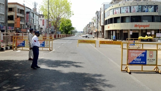 A deserted view of a road during curfew due to a surge in Covid-19 cases, in Bhopal.(ANI) A deserted view of a road during curfew due to a surge in Covid-19 cases, in Bhopal.(ANI)