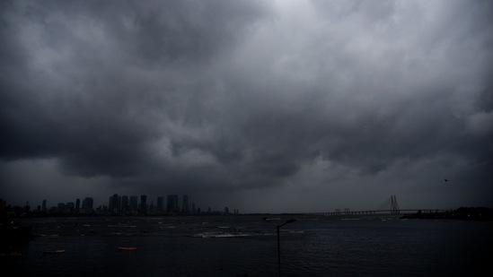 Dark clouds seen over the Mumbai skyline as Cyclone Tauktae passes close to Maharashtra, on May 17. Forecasters had warned of possible extensive damage from high winds, heavy rainfall and flooding in low-lying areas, AP reported.(Vijay Bate / HT Photo)