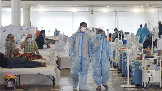 EDS PLS TAKE NOTE OF THIS PTI PICK OF THE DAY:::: New Delhi: COVID-19 patients undergo treatment at Guru Tegh Bahadur COVID Care Centre at the Gurdwara Rakab Ganj Sahib, in New Delhi, Tuesday, May, 18, 2021. (PTI Photo/Shahbaz Khan)(PTI05_18_2021_000053B)(PTI05_18_2021_000242B) (PTI) EDS PLS TAKE NOTE OF THIS PTI PICK OF THE DAY:::: New Delhi: COVID-19 patients undergo treatment at Guru Tegh Bahadur COVID Care Centre at the Gurdwara Rakab Ganj Sahib, in New Delhi, Tuesday, May, 18, 2021. (PTI Photo/Shahbaz Khan)(PTI05_18_2021_000053B)(PTI05_18_2021_000242B) (PTI)