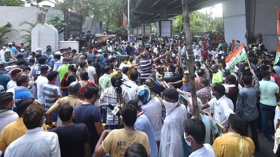 TMC workers gather outside the CBI office at Nizam Palace in protest against the arrest of party ministers and MLAs in connection with the Narada sting case, in Kolkata. (PTI ) TMC workers gather outside the CBI office at Nizam Palace in protest against the arrest of party ministers and MLAs in connection with the Narada sting case, in Kolkata. (PTI )