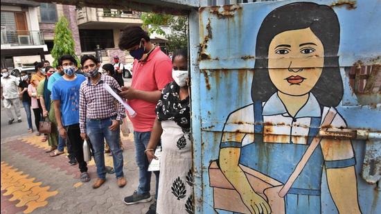 People queue up to get vaccinated against Covid-19, at SKV Railway Station, Anand Vihar, in New Delhi on Monday, May 17. (Raj K Raj / HT photo)