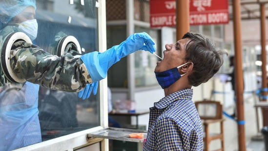 A health worker conducts Covid-19 testing at Ram Manohar Lohiya Hospital in Lucknow. (PTI file photo) A health worker conducts Covid-19 testing at Ram Manohar Lohiya Hospital in Lucknow. (PTI file photo)