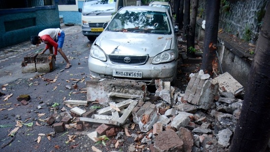 Debris of a compound wall which collapsed due to Cyclone Tauktae at Vasant Vihar in Thane.(PTI)