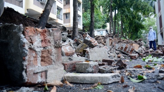 Debris of a compound wall which collapsed due to Cyclone Tauktae at Vasant Vihar in Thane.(PTI)