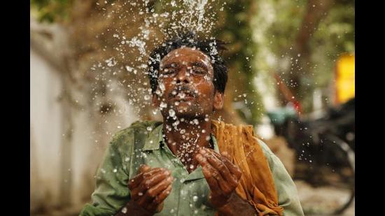 A study by the Energy Policy Institute at the University of Chicago show that rising temperatures can hurt economic output by reducing the productivity of human labour. The damage, the report added, is greatest when already warm days become hotter. (AP) A study by the Energy Policy Institute at the University of Chicago show that rising temperatures can hurt economic output by reducing the productivity of human labour. The damage, the report added, is greatest when already warm days become hotter. (AP)
