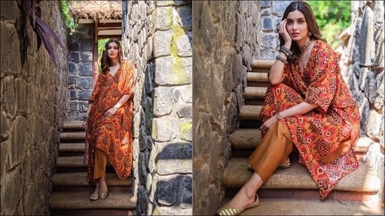 Looking charming as she slew summer fashion goals this March, Diana Penty opted for a rust-coloured kaftan featuring bold ikat print and teamed it with a pair of straight pants. Credited to Indian fashion label Drishti &amp; Zahabia, the kaftan was made of chanderi silk fabric and featured mirror work, thread and sequins hand embroidery to offset the bold ikat print.(Instagram/dianapenty)