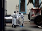 Relatives and family members of a Covid-19 victim collecting the body at the mortuary at Maulana Azad Medical College in New Delhi on May 18. India saw a record 4,529 fatalities due to the coronavirus in a single day pushing the national Covid-19 death toll to 2,83,248, the Union Health Ministry data updated on May 19 showed.(Sanjeev Verma / HT Photo)