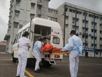 Members of the Indian Navy transport a person after a rescue from a sunken barge in the Arabian Sea in the aftermath of cyclone Tauktae's landfall, at naval air station INS Shikra in Mumbai, REUTERS