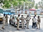 The Bengaluru police stand guard at BMTC bus stand, as coronavirus cases surge in Bengaluru, Wednesday(PTI) The Bengaluru police stand guard at BMTC bus stand, as coronavirus cases surge in Bengaluru, Wednesday(PTI)