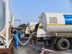 About 260 metric tonnes of oxygen has also been received from other states in three separate consignments, Oxygen supply nodal officer Ranjit Sinha said. In picture - Oxygen Express being loaded at Harrawala railway station, Dehradun.