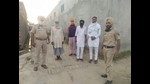 Residents and police personnel during a thikri pehra in a village. Residents and police personnel during a thikri pehra in a village.
