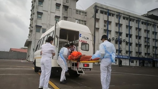 Members of the Indian Navy transport a person after a rescue from a sunken barge in the Arabian Sea in the aftermath of cyclone Tauktae's landfall, at naval air station INS Shikra in Mumbai, REUTERS(via REUTERS)