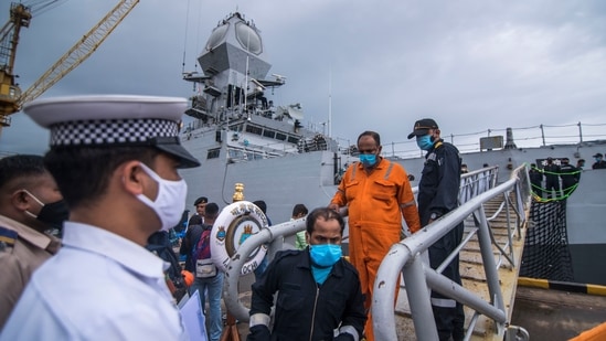 "The stranding, drifting and subsequent events have led to loss of several lives," the central ministry statement said. In picture - Crew members of ONGC's Barge P305 who were stranded in the Mumbai offshore due to Cyclone Tauktae rescued by the Indian Navy.(HT Photo )