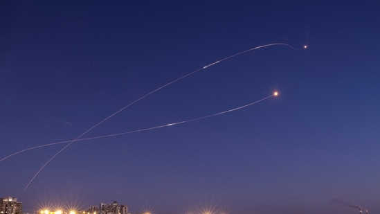 Streaks of light are seen as Israel's Iron Dome anti-missile system intercept rockets launched from the Gaza Strip towards Israel, as seen from Ashkelon on May 19, 2021. (REUTERS)