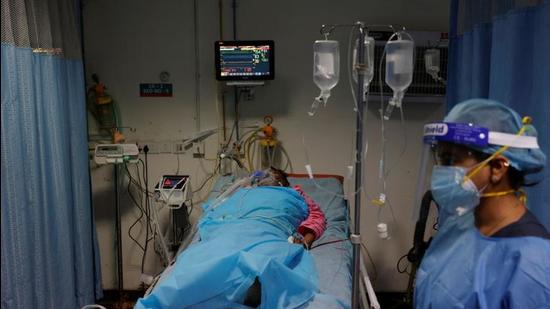 A man suffering from coronavirus disease receives treatment at Safdarjung Hospital in New Delhi, India. (REUTERS)