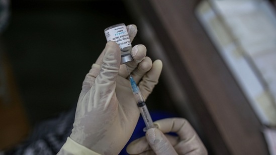 A nurse prepares a dose of Bharat Biotech Ltd. Covaxin vaccine at a Covid-19 vaccination center.(Bloomberg)