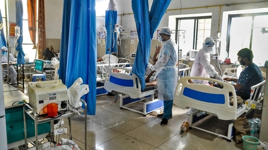 Medics check on Covid-19 patients at a hospital.(PTI)