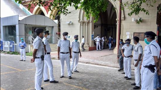 Police personnel guard at the Calcutta high court, during a hearing on the Narada scam case, in Kolkata on Wednesday, May 19. (PTI) Police personnel guard at the Calcutta high court, during a hearing on the Narada scam case, in Kolkata on Wednesday, May 19. (PTI)