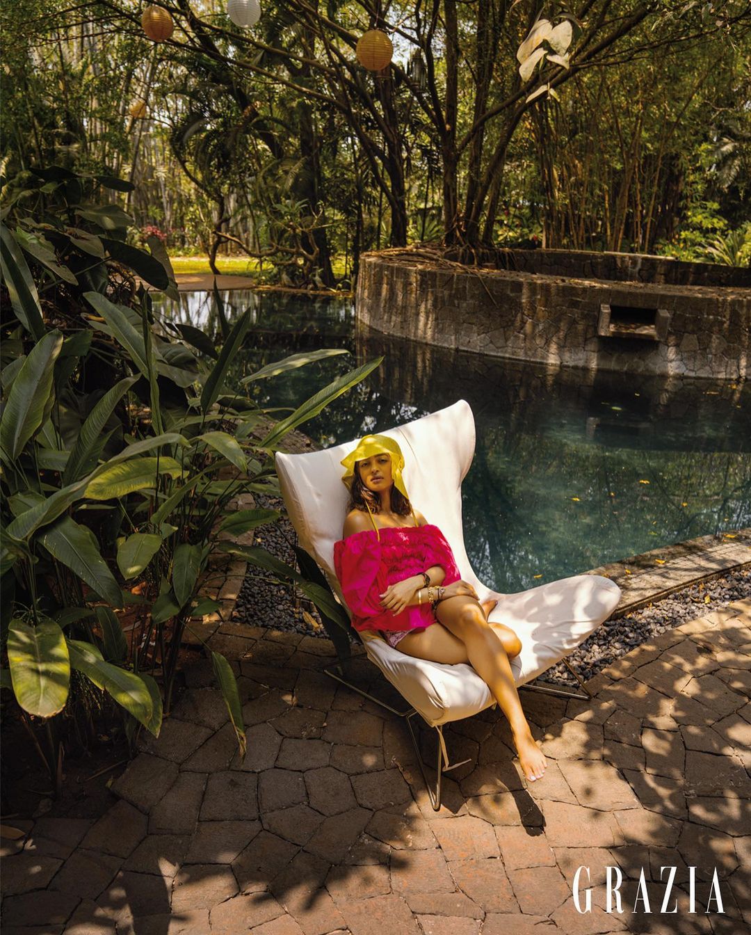 Radhika Apte in a vibrant fuchsia off-shoulder ‘Aya’ blouse from Malie, a ‘Remi Scrunch’ bikini bottom from Là Fuori and a contrasting yellow bucket hat from Dhruv Kapoor,(Instagram/graziaindia)