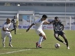 Players in action during Hero I league football match between Punjab (black) and Real Kashmir (white) in Guru Nanak Stadium in Ludhiana.