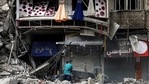 Palestinian men hug in front of Al-Shuruq building, destroyed by an Israeli air strike, in Gaza City on May 21. A ceasefire between Israel and Hamas, the Islamist movement which controls the Gaza Strip, appeared to hold on May 21 after 11 days of deadly fighting that pounded the Palestinian enclave and forced countless Israelis to seek shelter from rockets. Palestinian men hug in front of Al-Shuruq building, destroyed by an Israeli air strike, in Gaza City on May 21. A ceasefire between Israel and Hamas, the Islamist movement which controls the Gaza Strip, appeared to hold on May 21 after 11 days of deadly fighting that pounded the Palestinian enclave and forced countless Israelis to seek shelter from rockets.