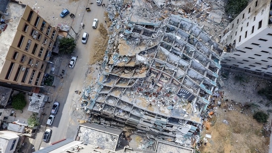 An aerial view of the Jala Tower in Gaza City, levelled by an Israeli air-strike. Israeli aerial bombardment of the densely populated enclave killed 243 Palestinians, including 66 children, wounded more than 1,900 and damaged critical infrastructure and thousands of homes, Reuters reported.(Mahmud Hams / AFP)