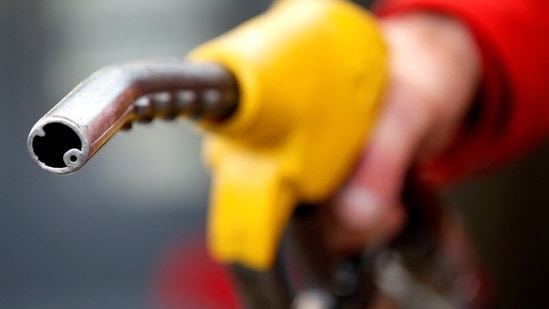 A petrol station attendant prepares to refuel a car. (REUTERS)