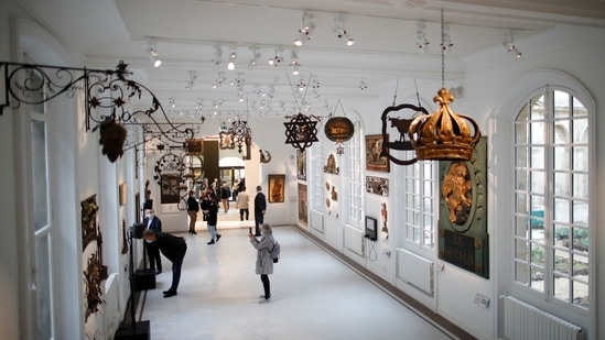 Journalists visit the Hall of Signs (Salle des Enseignes) at the Carnavalet-History of Paris Museum, located in the Marais district, during a press visit after four years of renovations in Paris, France, May 20, 2021.  (REUTERS)