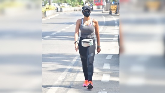To add a pop of colour to her gym look, Mandira stepped into a pair of pink sneakers and completed her attire by wearing a fanny pack.(Varinder Chawla)