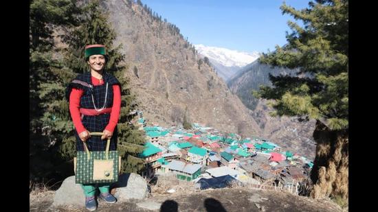 Nirma Devi, the lone accredited social health activist at Malana (in the backdrop), says that she will also take the vaccine along with the villagers. (HT Photo) Nirma Devi, the lone accredited social health activist at Malana (in the backdrop), says that she will also take the vaccine along with the villagers. (HT Photo)