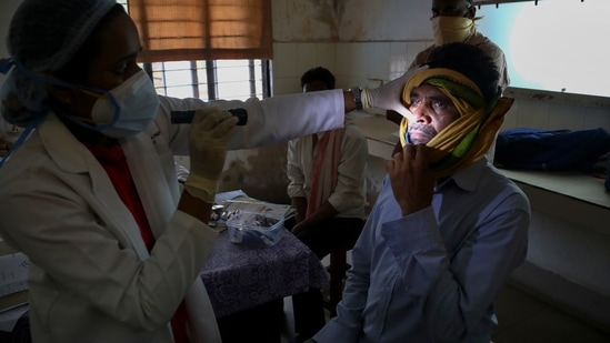 A doctor checks a man who recovered from Covid-19 and now infected with black fungus at the Mucormycosis ward of a government hospital in Hyderabad. (AP)
