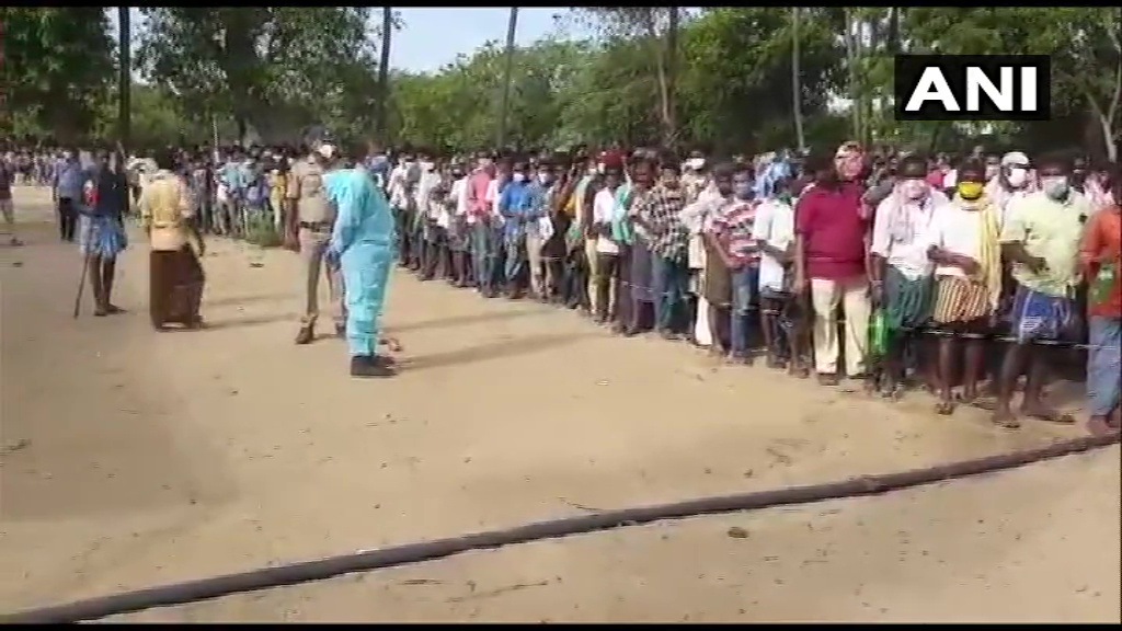 People in Nellore flout Covid-19 rules as they queue for Covid-19 medicine from an Ayurvedic practitioner. (ANI Photo) People in Nellore flout Covid-19 rules as they queue for Covid-19 medicine from an Ayurvedic practitioner. (ANI Photo)