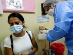 Grace Escudero, 20, receives her second dose of the Pfizer Covid-19 vaccine during a mass vaccination campaign in Taboga Island, Panama,. Grace Escudero, 20, receives her second dose of the Pfizer Covid-19 vaccine during a mass vaccination campaign in Taboga Island, Panama,.