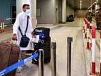 A passenger flying in from India arrives with his luggage at the Fiumicino International airport. A passenger flying in from India arrives with his luggage at the Fiumicino International airport.