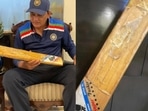 Mohammad Azharuddin poses with his record-breaking willow.
