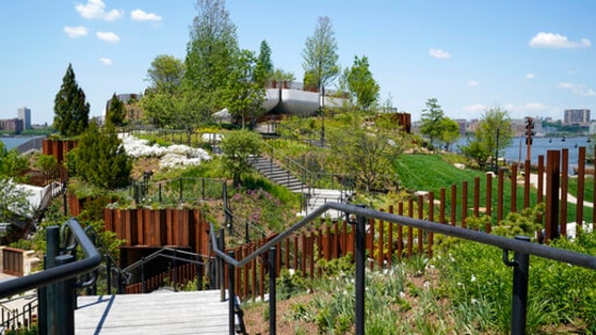 A stairway leads to one of the highest points of Little Island, a new Hudson River Park, on Tuesday, May 18, 2021, in New York. Designed to create an immersive experience combining nature and art, the park is scheduled to open to the public Friday. There are two amphitheaters, a casual outdoor dining space, winding footpaths and stairways leading to multiple views of the city and a playground. (AP)