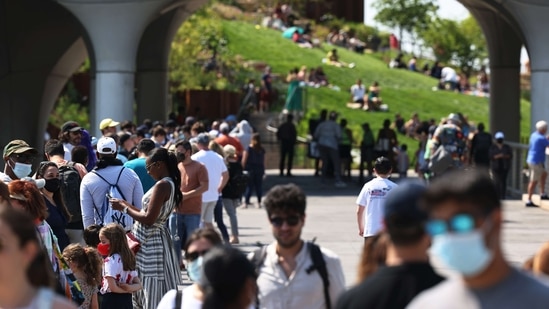 People wait in line to enter the Little Island public park on Hudson River Park in Manhattan on May 21, 2021 in New York City. The Little Island public park on 13th Street in Hudson River Park opened for the first time to the public on Friday. The features 350 different flowers, trees and shrubs. A 687-seat amphitheater with independent arts programming starting in June. The park also has space for seating for food and beverages from vendors. (AFP)
