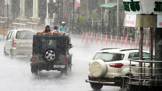 Commuters traveling during a heavy rain due to cyclone Tauktae in Lucknow on May 20, 2021. (ANI file photo) Commuters traveling during a heavy rain due to cyclone Tauktae in Lucknow on May 20, 2021. (ANI file photo)