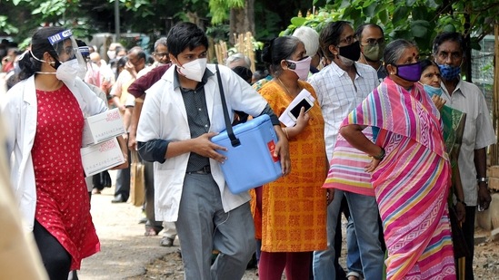 People stand in a queue to receive the dose of the Covid-19 vaccine at Vani Vilas hospital in Bengaluru. People stand in a queue to receive the dose of the Covid-19 vaccine at Vani Vilas hospital in Bengaluru.