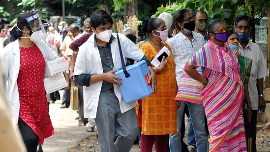People stand in a queue to receive the dose of the Covid-19 vaccine at Vani Vilas hospital in Bengaluru. People stand in a queue to receive the dose of the Covid-19 vaccine at Vani Vilas hospital in Bengaluru.