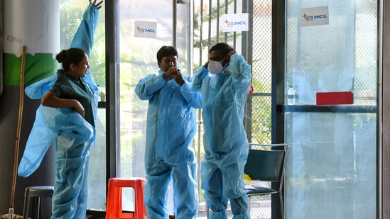 Health workers wearing PPE kits at CWG Covid care center in New Delhi on Saturday. (ANI Photo) Health workers wearing PPE kits at CWG Covid care center in New Delhi on Saturday. (ANI Photo)