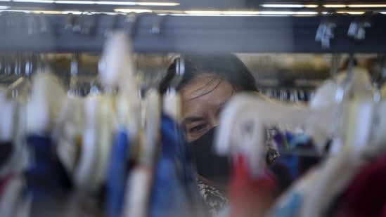 A customer views clothing for sale at a Family Thrift Outlet store in Houston, Texas, U.S., on Sunday, April 25, 2021. (Bloomberg)